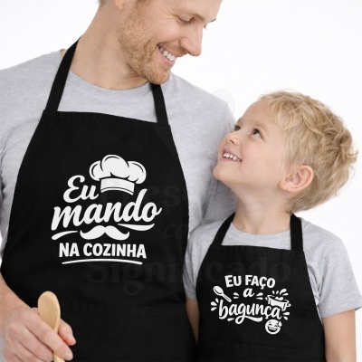 Aventais de cozinha pretos com textos divertidos em branco usados por adulto e criança