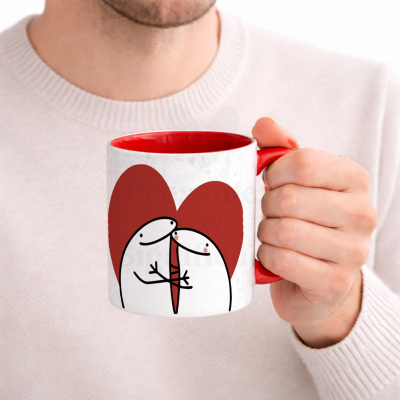 Caneca branca com interior e asa vermelha e ilustração de casal abraçado