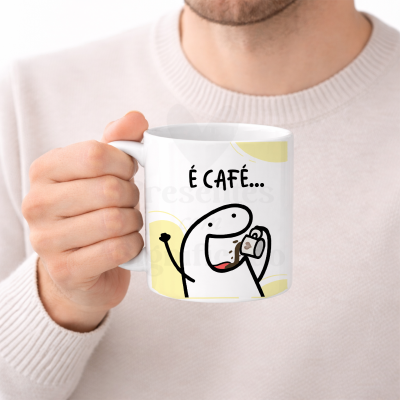 Caneca branca com ilustração e texto É CAFÉ...