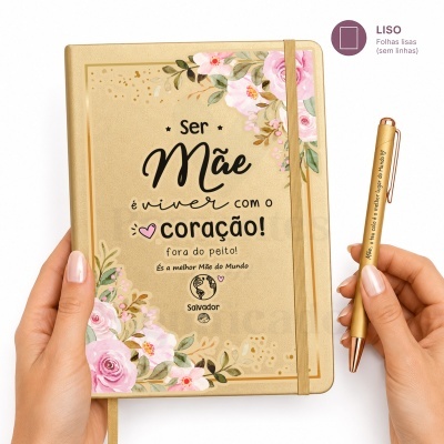 Caderno dourado com flores rosa e texto sobre ser mãe e uma caneta dourada com mensagem para mãe.
