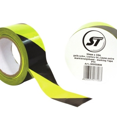 Dois rolos de fita marcadora amarelo e preto com etiqueta visível