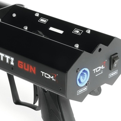 Máquina lançadora de confetes preta com textos CONFETTI GUN TCM1x e botões de controlo