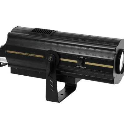 Projetor preto cilíndrico com faixa dourada e lente circular