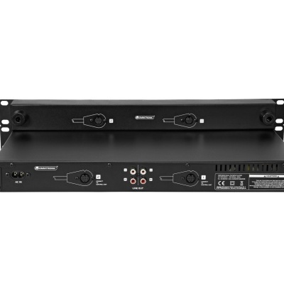 Dispositivo eletrónico preto com múltiplas conexões traseiras e etiquetas de certificação.