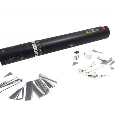 Tubo preto de lançamento de confetes com confetes prateados espalhados.