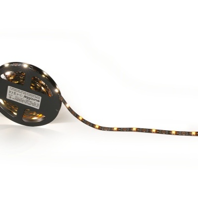 Fita de luz LED amarela enrolada numa bobina preta