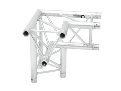 Estrutura metálica prateada feita de tubos cilíndricos em ângulo