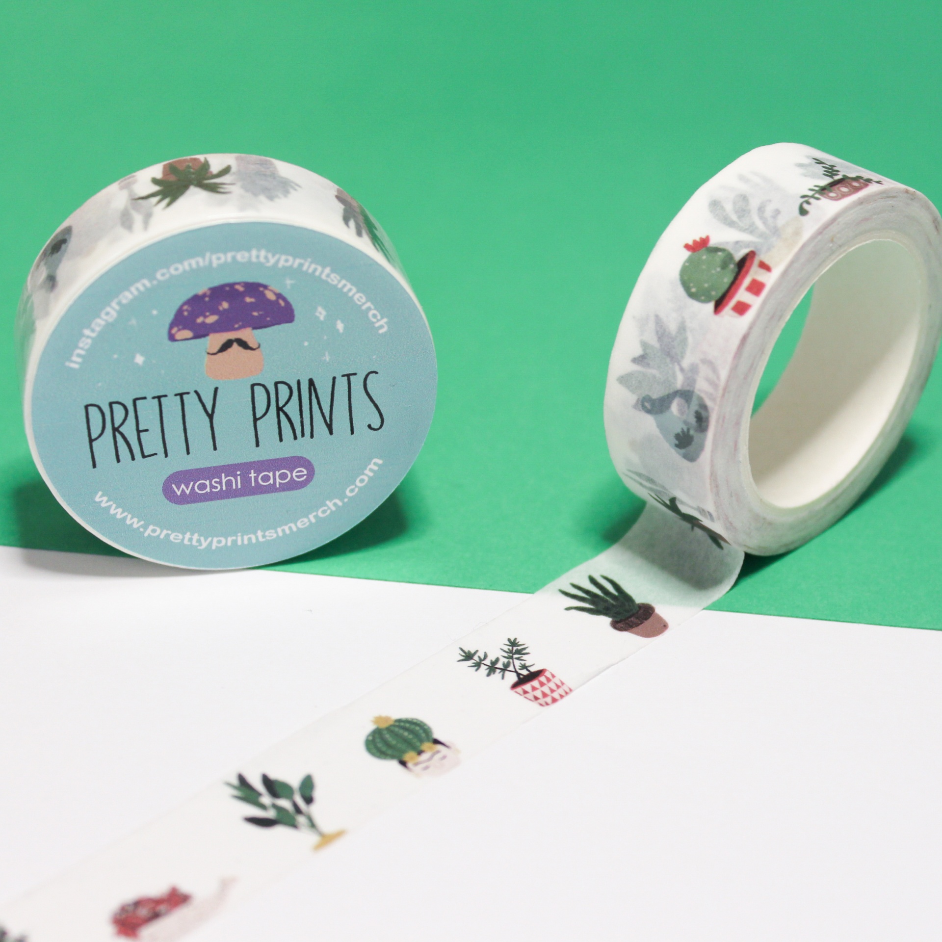 Rolos de fita washi tape com estampado de cactos em vasos, um com etiqueta azul da marca Pretty Prints.