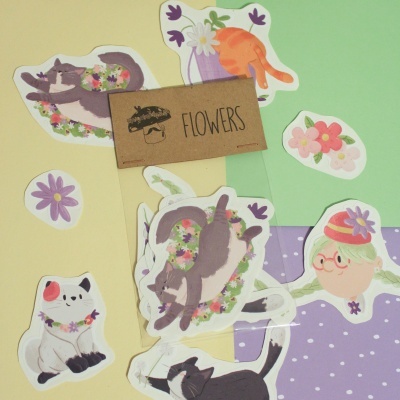 Autocolantes ilustrados de gatos, flores e uma personagem feminina com chapéu verde
