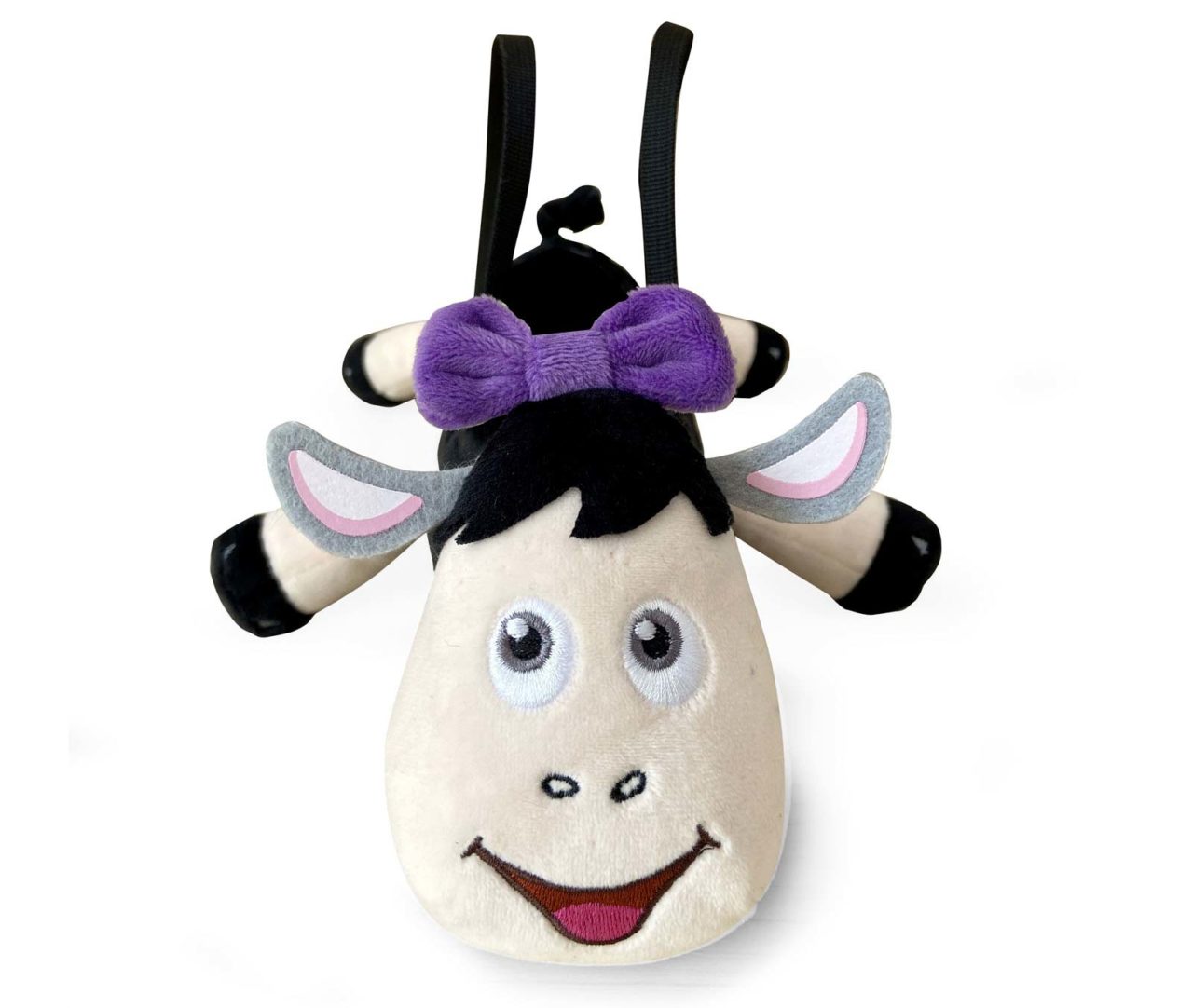 Mala de peluche em forma de vaca com laço roxo e alças pretas