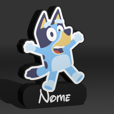 Figura decorativa de cão animado colorido sobre base preta com texto Nome