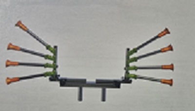 Dispositivos com hastes pretas e ponteiras laranja em suportes verdes