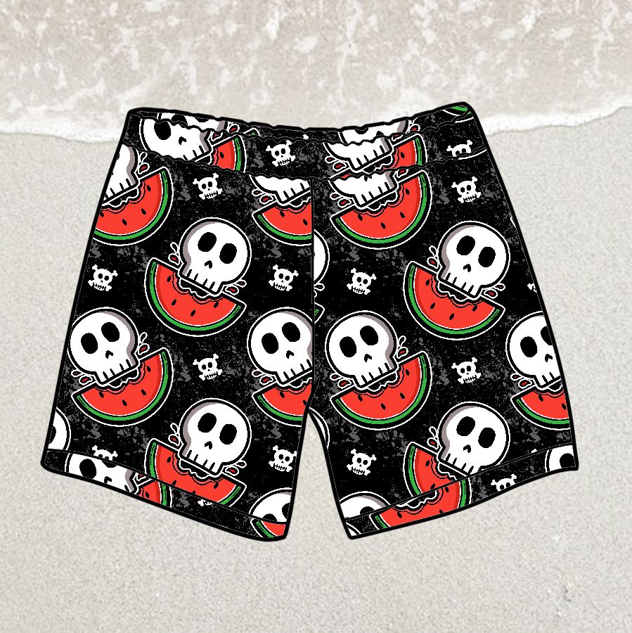 Calções de banho com padrão de caveiras e melancias sobre areia