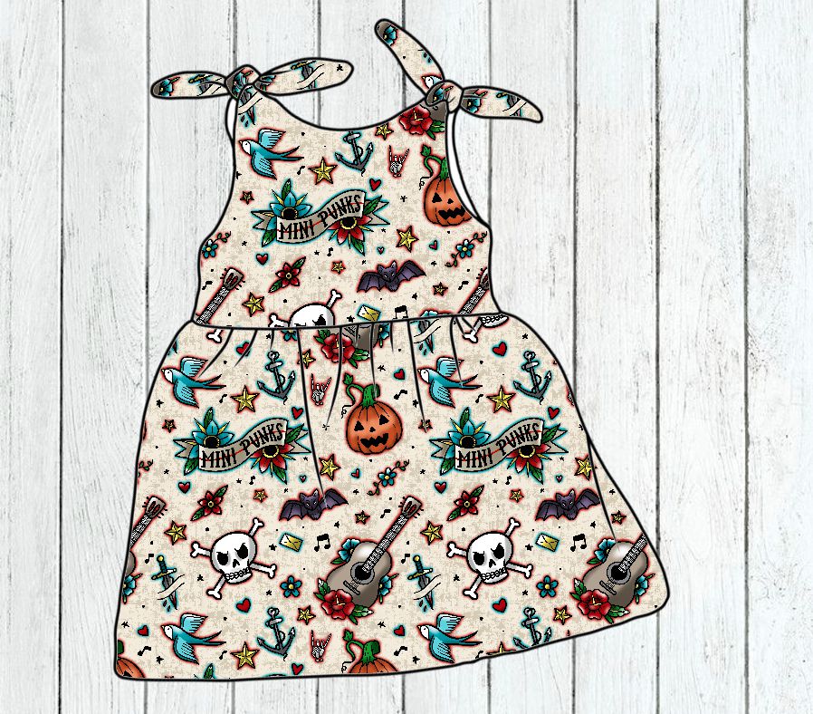 Vestido infantil com padrão colorido de caveiras, guitarras e Halloween em fundo bege