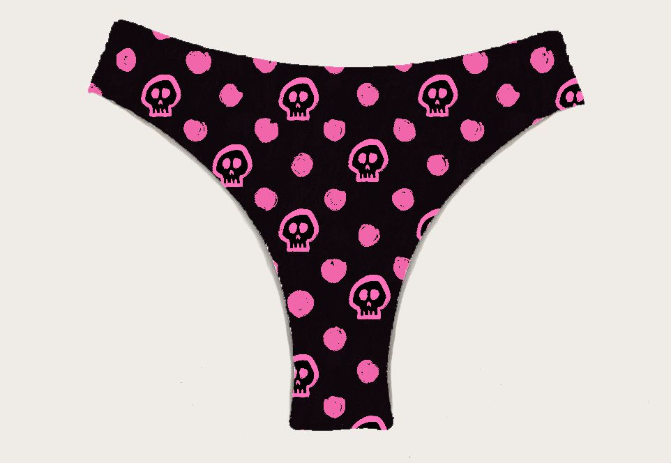 Cueca tanga preta com caveiras e bolas cor-de-rosa