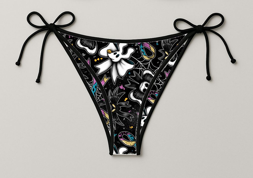 Cuecas de bikini pretas com padrão colorido e laços nas laterais.