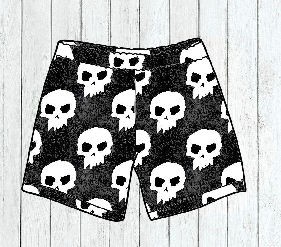 Calções pretos com padrão de caveiras brancas