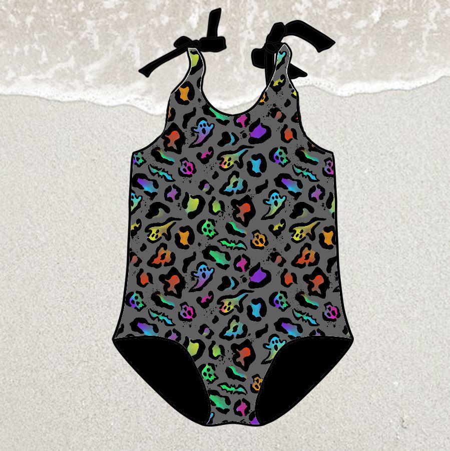 Fato de banho infantil com padrão animal print colorido e alças com laços