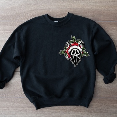 Sweatshirt preta com estampa colorida de caveira e guirlanda