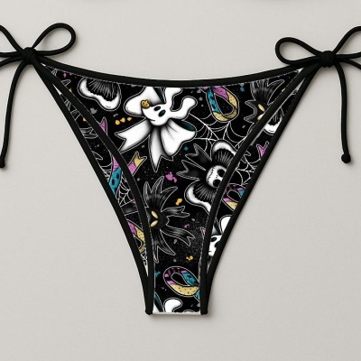Cuecas de bikini pretas com padrão colorido e laços nas laterais.