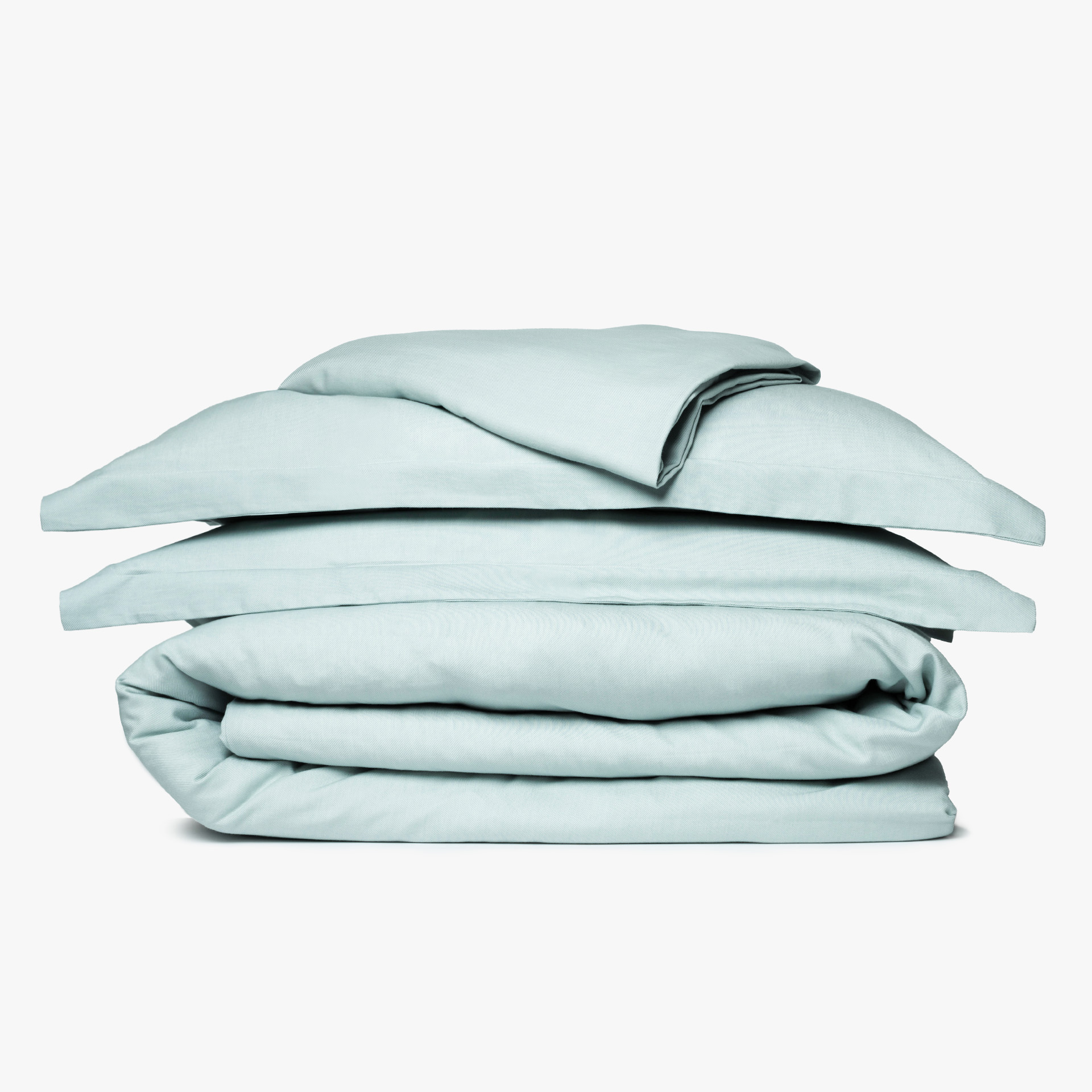 Conjunto de roupa de cama azul claro dobrado