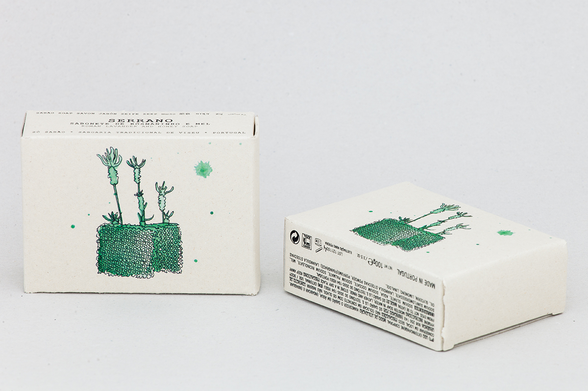 Sabonete de Rosmaninho e Mel Caixas de sabonete branco com ilustração verde e texto preto Serrano
