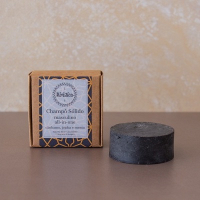 Champô sólido masculino all-in-one em barra preta com embalagem de papel castanho e rótulo decorativo.