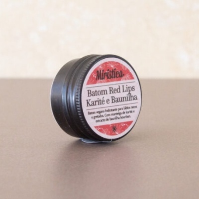 Embalagem circular preta de batom Red Lips Karité e Baunilha da marca Mirística