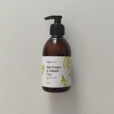 Frasco castanho de gel para corpo e cabelo com doseador preto sobre fundo cinza