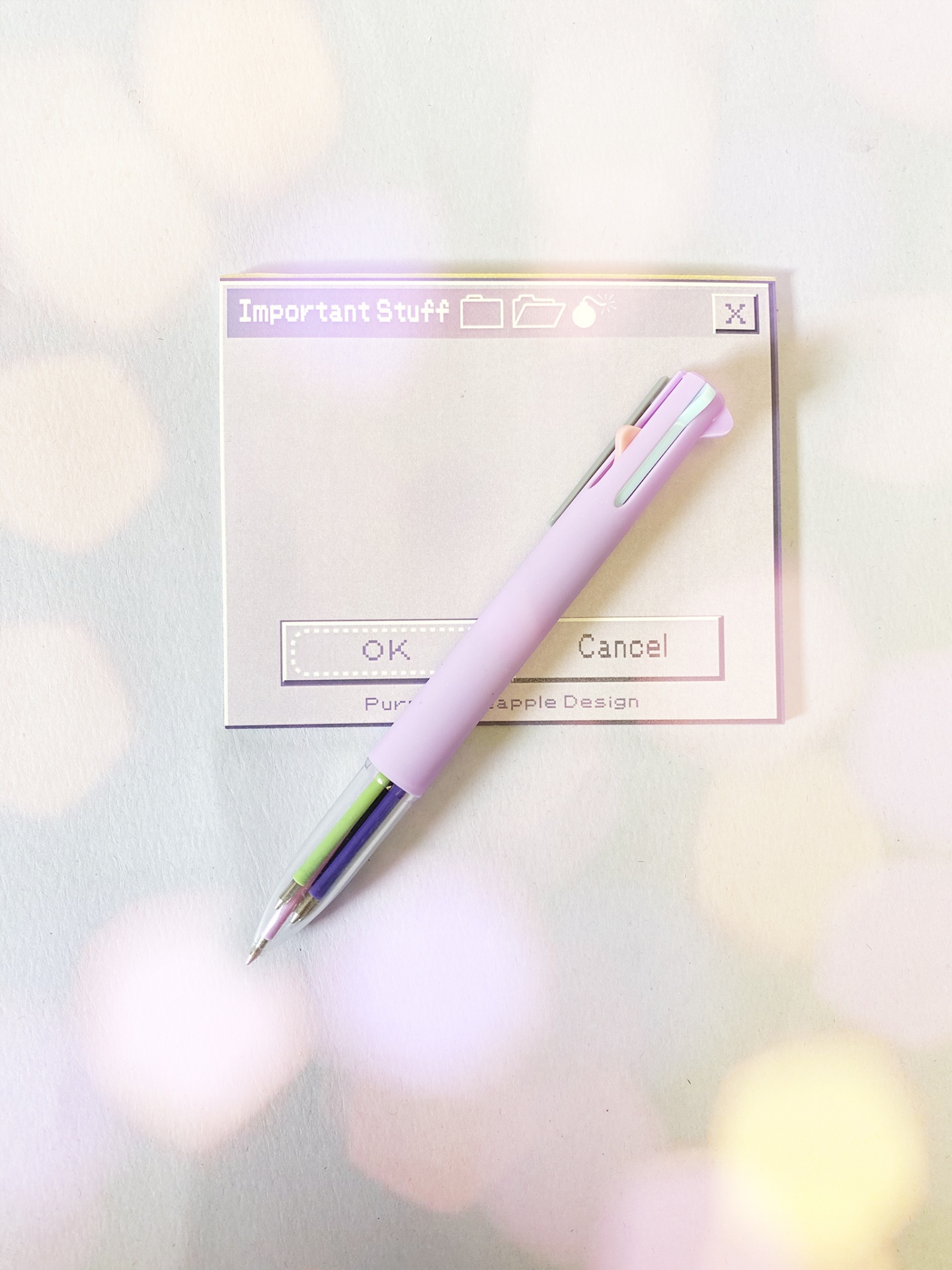 Caneta rosa multicolor sobre papel branco com texto 'Important Stuff' e botões 'OK' e 'Cancel'