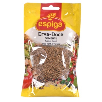 Pacote amarelo e vermelho da marca espiga com sementes de erva-doce visíveis