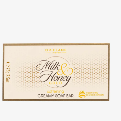 Embalagem de sabonete cremoso Milk & Honey Gold da Oriflame com design branco e dourado.