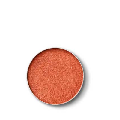 Pigmento em pó cor de terracota circular sobre fundo branco