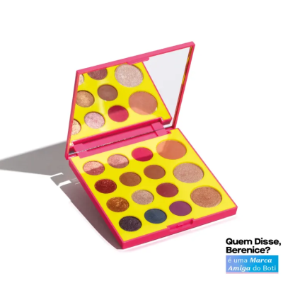 Paleta de sombras de olhos multicolorida numa caixa amarela com espelho