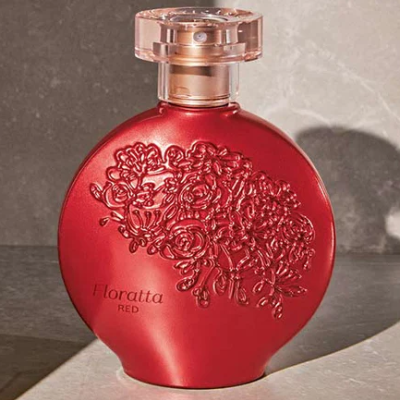 Frasco de perfume redondo vermelho com decoração de flores e tampa transparente