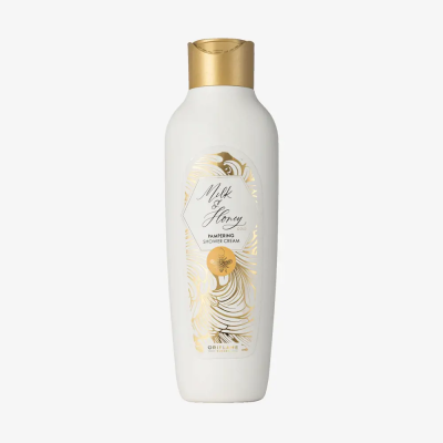 Frasco branco com tampa dourada e etiqueta Milk & Honey
