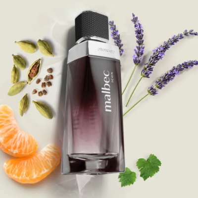 Frasco de perfume Malbec com tampa preta e elementos naturais ao redor