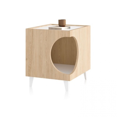 Móvel cúbico de madeira clara com perna branca e abertura oval