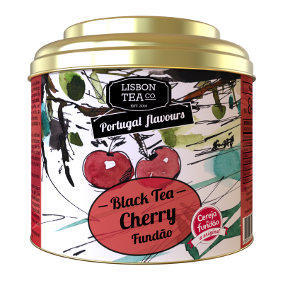 Lata dourada de chá preto sabor cereja com ilustração de cerejas e ramos