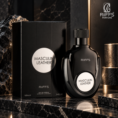 Frasco e caixa de perfume Masculin Leather da RiiFFS em preto com detalhes prateados sobre mármore negro.