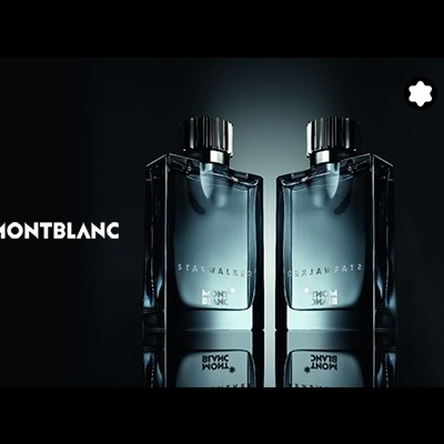 Dois frascos de perfume Montblanc Starwalker em vidro translúcido com tampas pretas, refletidos numa superfície escura, com logotipo e símbolo da marca visíveis.