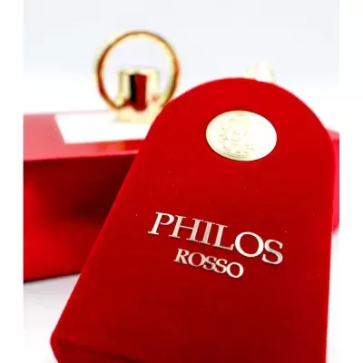 Frasco de perfume vermelho com texto PHILOS ROSSO