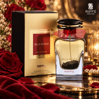 Frasco de perfume Bella Rouge ao lado da caixa dourada com etiqueta vermelha e decoração vermelha e dourada