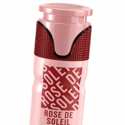 Frasco rosa com tampa e texto Rose de Soleil
