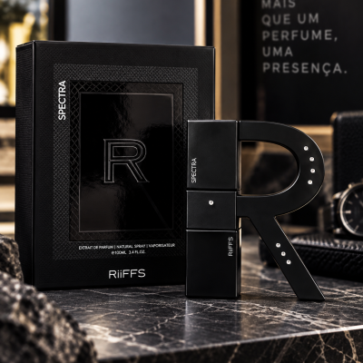 Perfume Riiffs Spectra em embalagem preta com frasco em forma da letra R sobre mármore