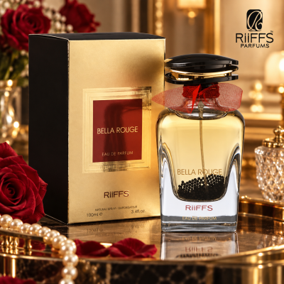 Perfume Bella Rouge da RiiFFS com embalagem dourada e detalhes em vermelho num cenário elegante
