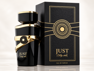 Frasco de perfume preto e dourado ao lado de caixa preta decorativa com texto JUST أسود