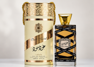Frasco de perfume dourado e preto com embalagem dourada cilíndrica