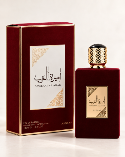 Frasco de perfume e caixa vermelha com detalhes dourados