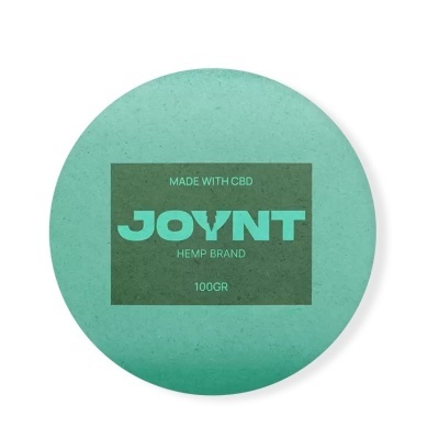 Embalagem redonda verde com etiqueta verde-escuro e texto JOYNT HEMP BRAND.